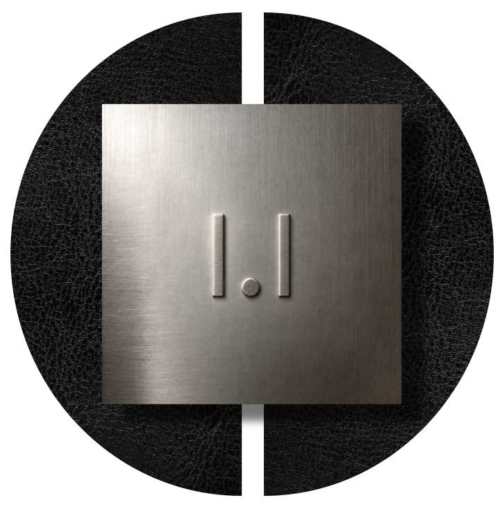 I.I metal brand mark in a black circular composition